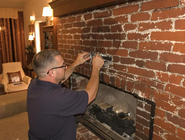 Pasadena Chimney Sweep expert fixing a fireplace in Pasadena, CA